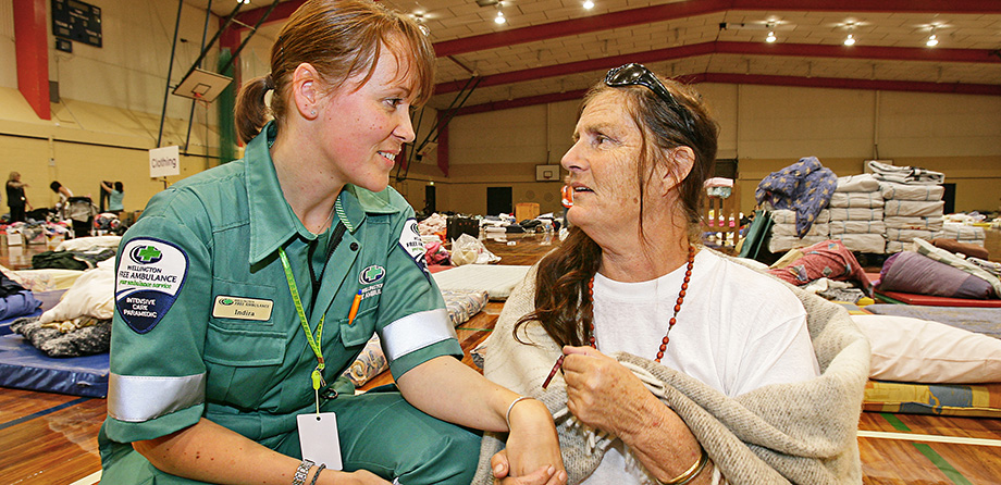 A Wellington Free Paramedic comforting a CHCH resident after the earthquake.