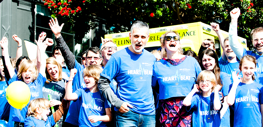 Group of adults and children cheering