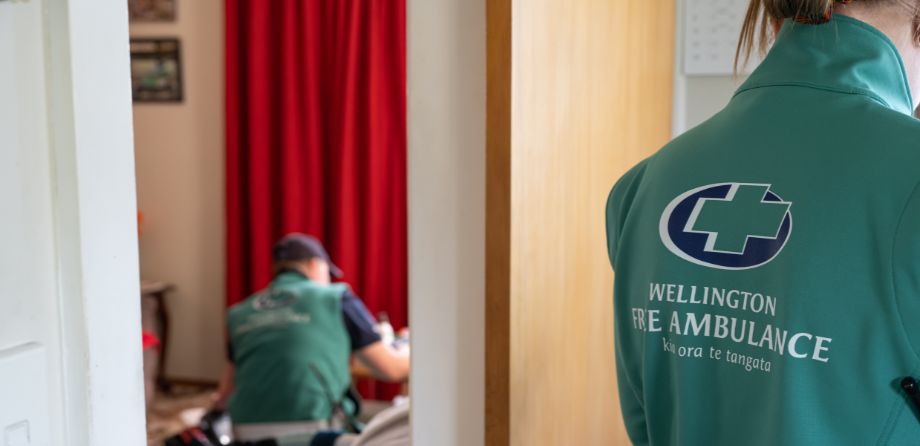 The back of a paramedic standing in a doorway