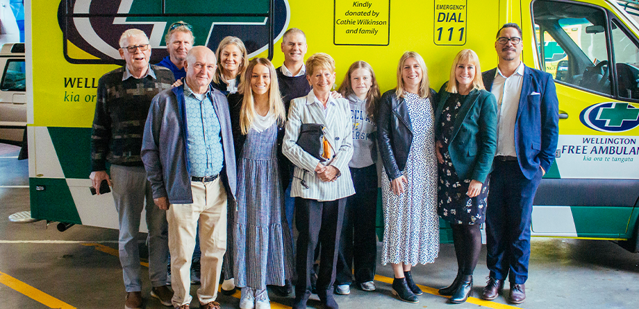 Cathie Wilkinson and her family in front of our new ambulance.