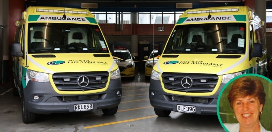 Two ambulances with a small folder of a smiling woman
