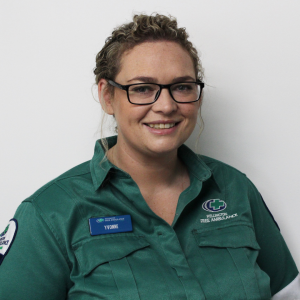 A woman in glasses and a green Wellington Free uniform