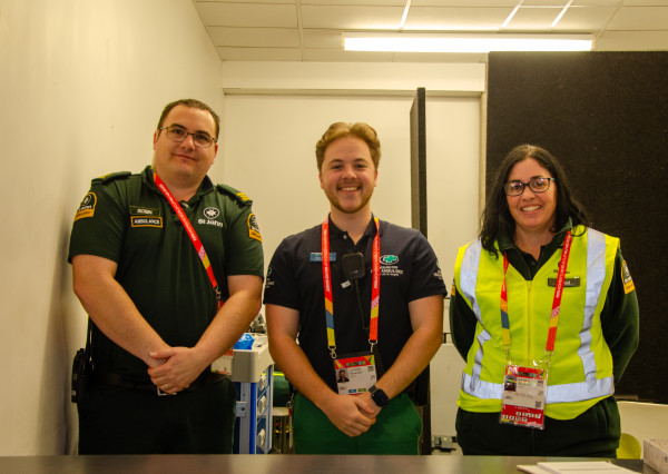 3 people in paramedic uniforms smile