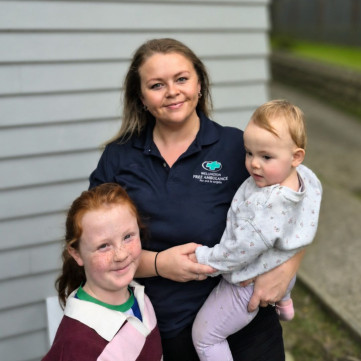 A woman with 2 children