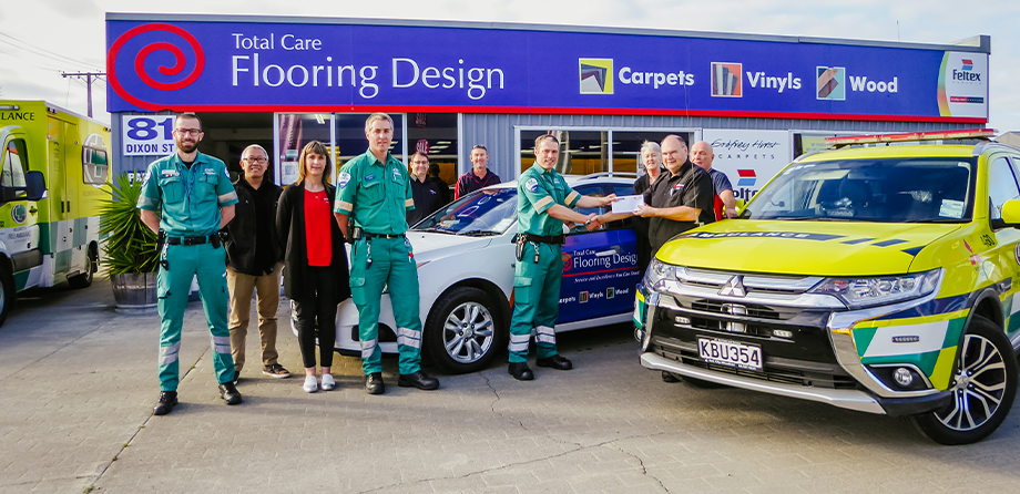 Wellington Free Ambulance collecting a donation from Total Care Flooring Design