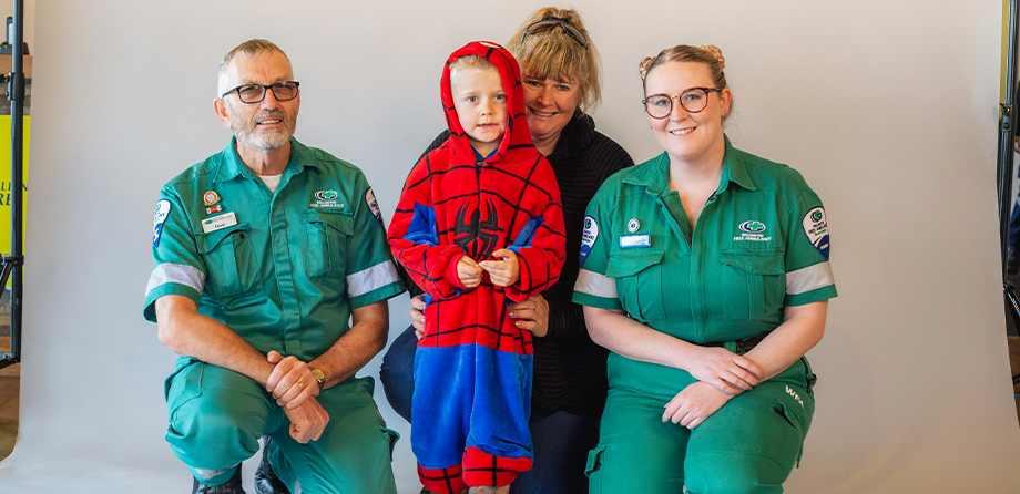 Troy and his mum Mandy with Wellington Free paramedics