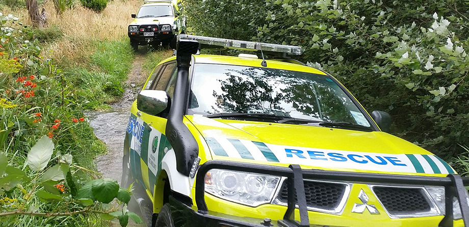 Wellington Free Ambulance rescue vehicles driving through bush