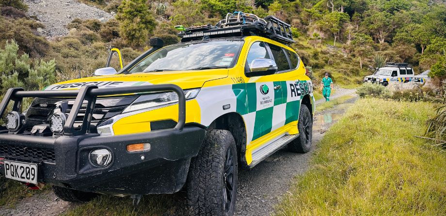 A Rescue Squad 4 wheel drive with a bush backdrop