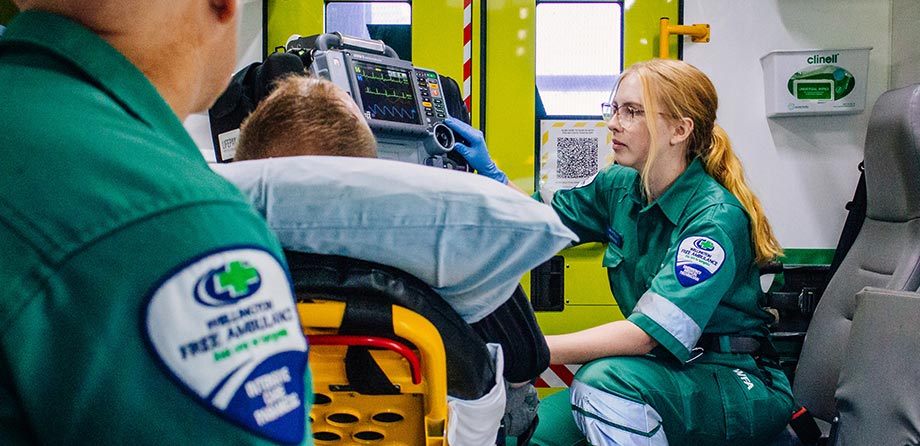 Clinical Care: Paramedics caring for patient in ambulance