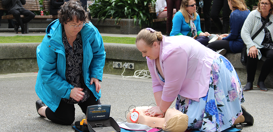 Two members of the public learning CPR