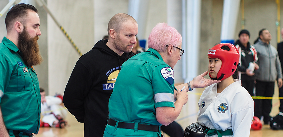 Event medic treating a young boy 