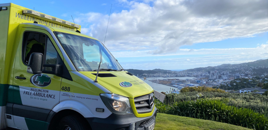 An ambulance with the background of Wellington Harbour